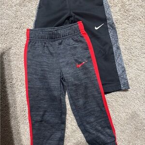Nike Kids Black & Red Joggers with Side Stripe